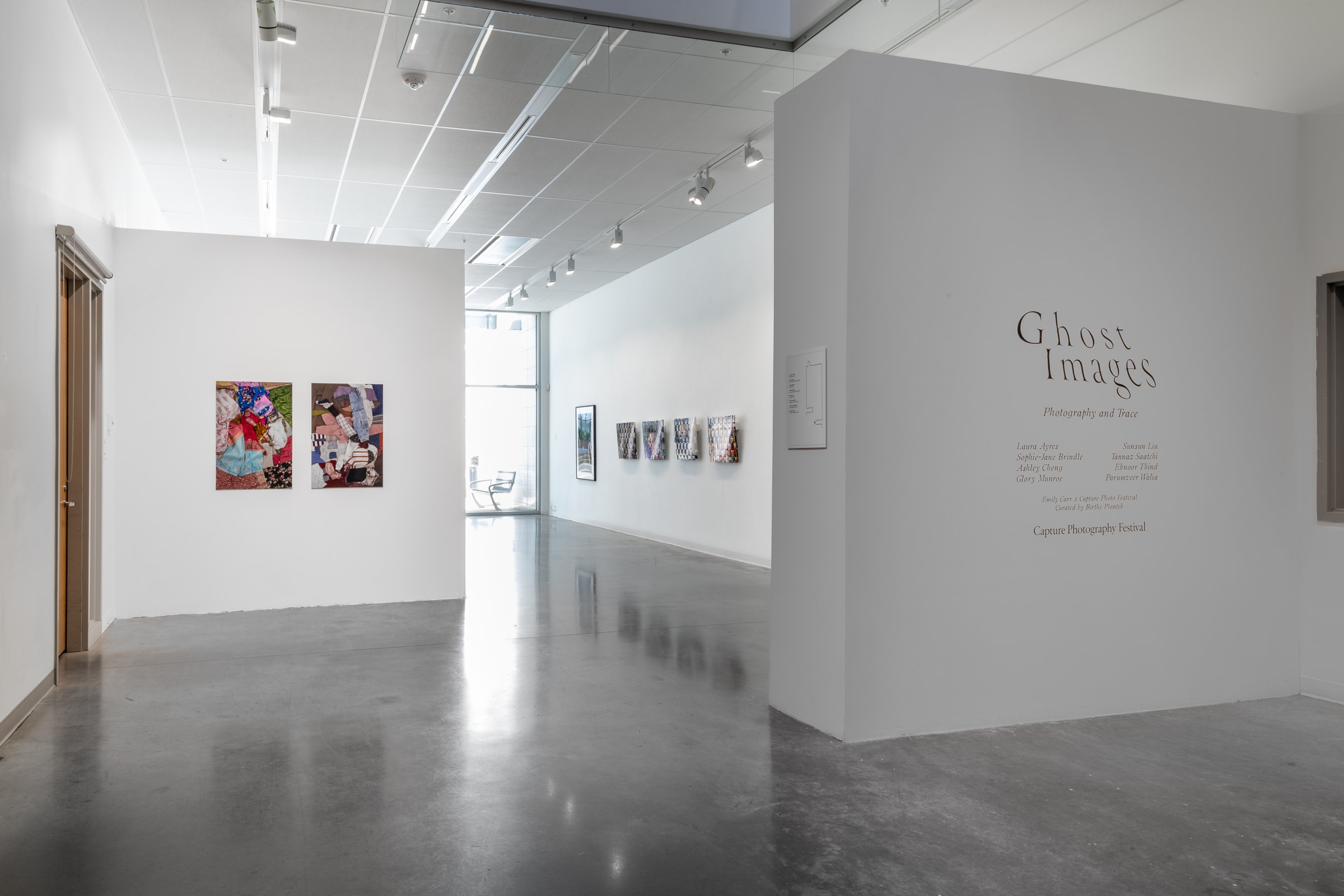 Gallery corridor with white walls and framed artworks, featuring a wall text for “Ghost Images: Photography and Trace” exhibition at Emily Carr University.