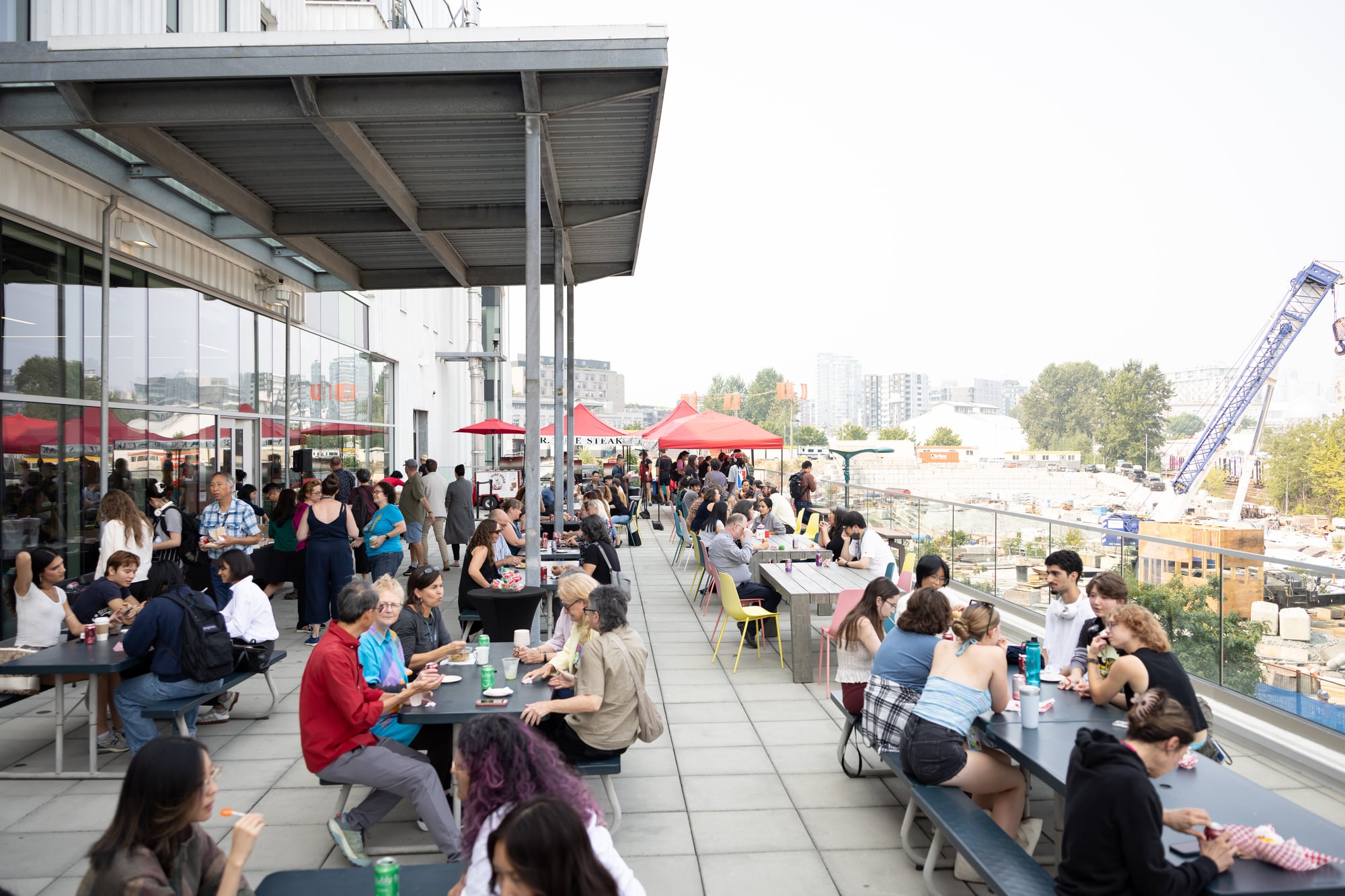 A large crowd of students and staff fill an atrium during ECU’s Welcome Week, mingling and socializing under bright natural light.