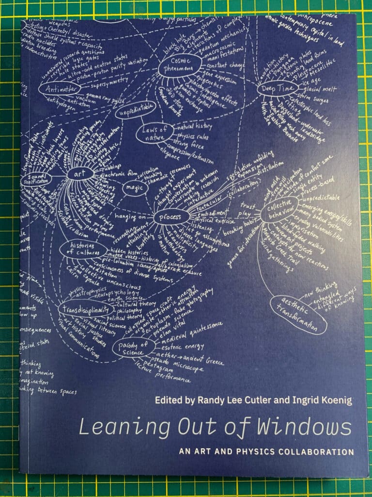 Book cover of Leaning Out of Windows: An Art and Physics Collaboration, showing a blue background with a white hand-drawn concept map connecting words and themes such as “art,” “laws of nature” and “deep time.”