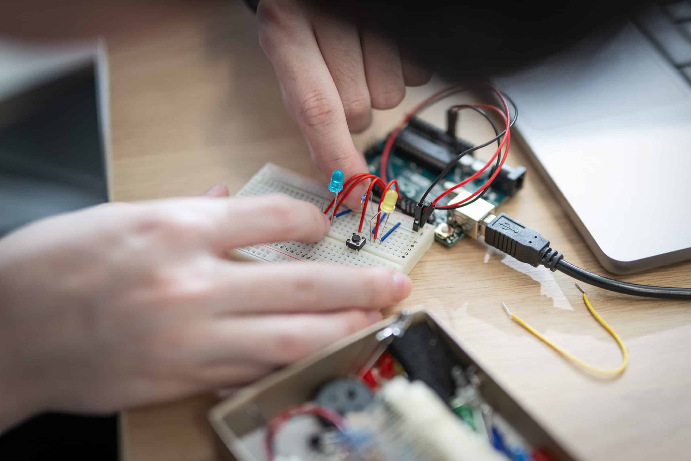 Student building a physical computing circuit.