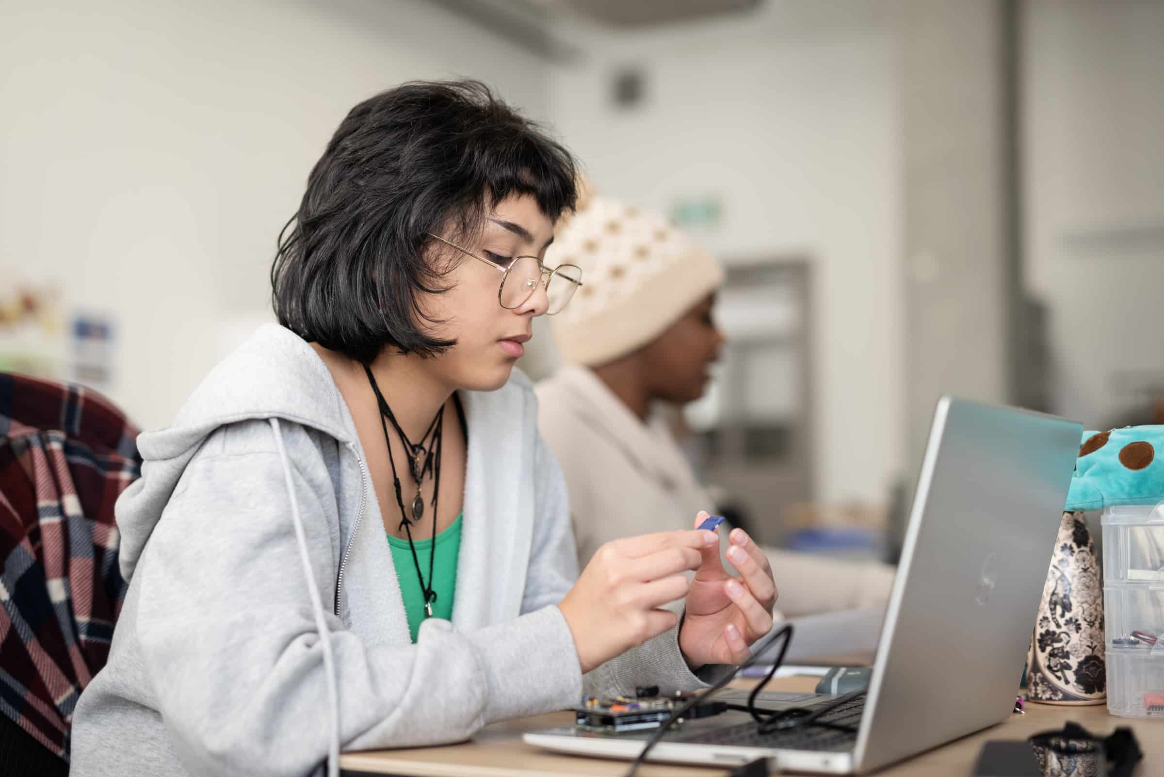 Student working on a circuit in the Interaction Design Lab.