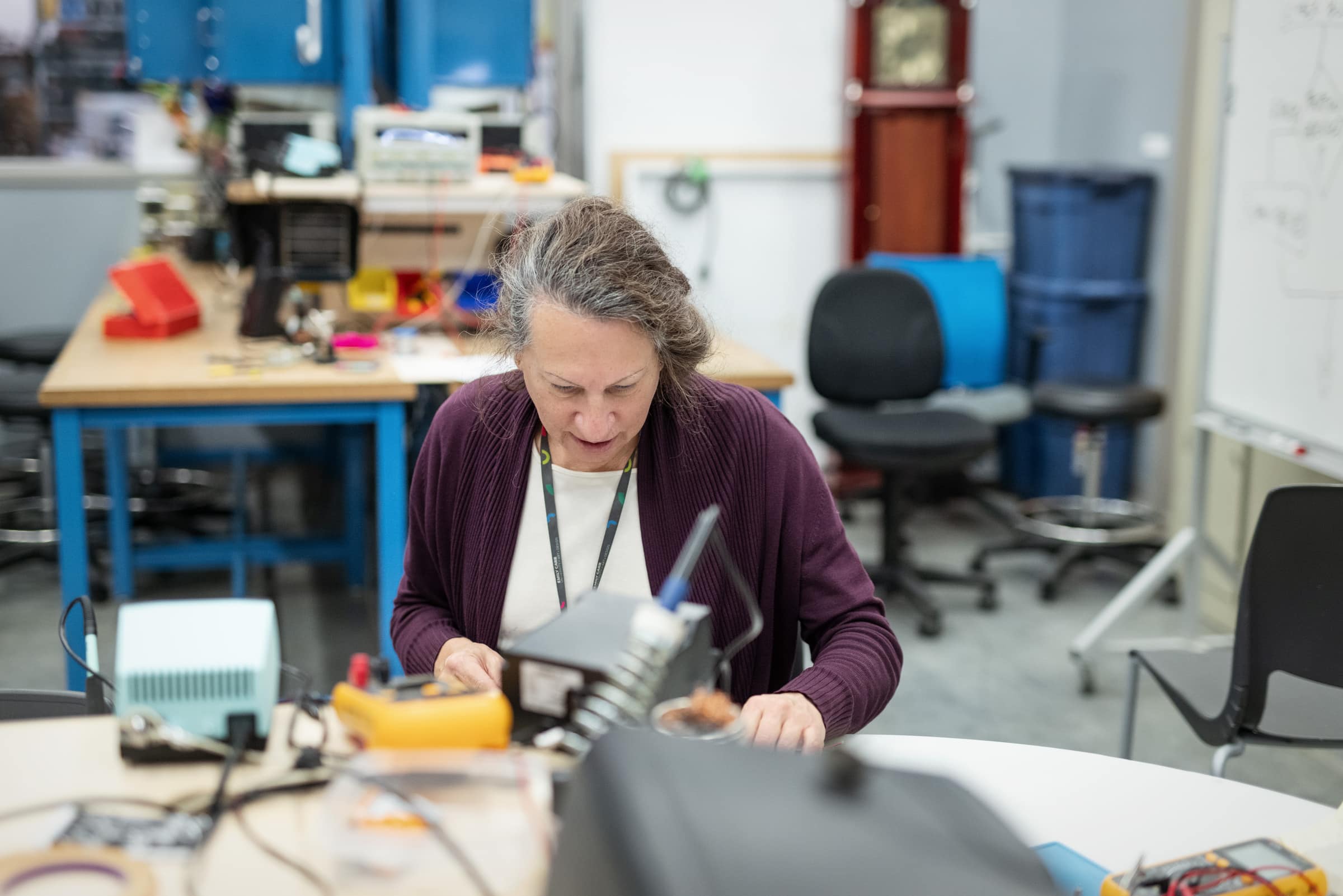 Technician working at a table in the WIP Lab.
