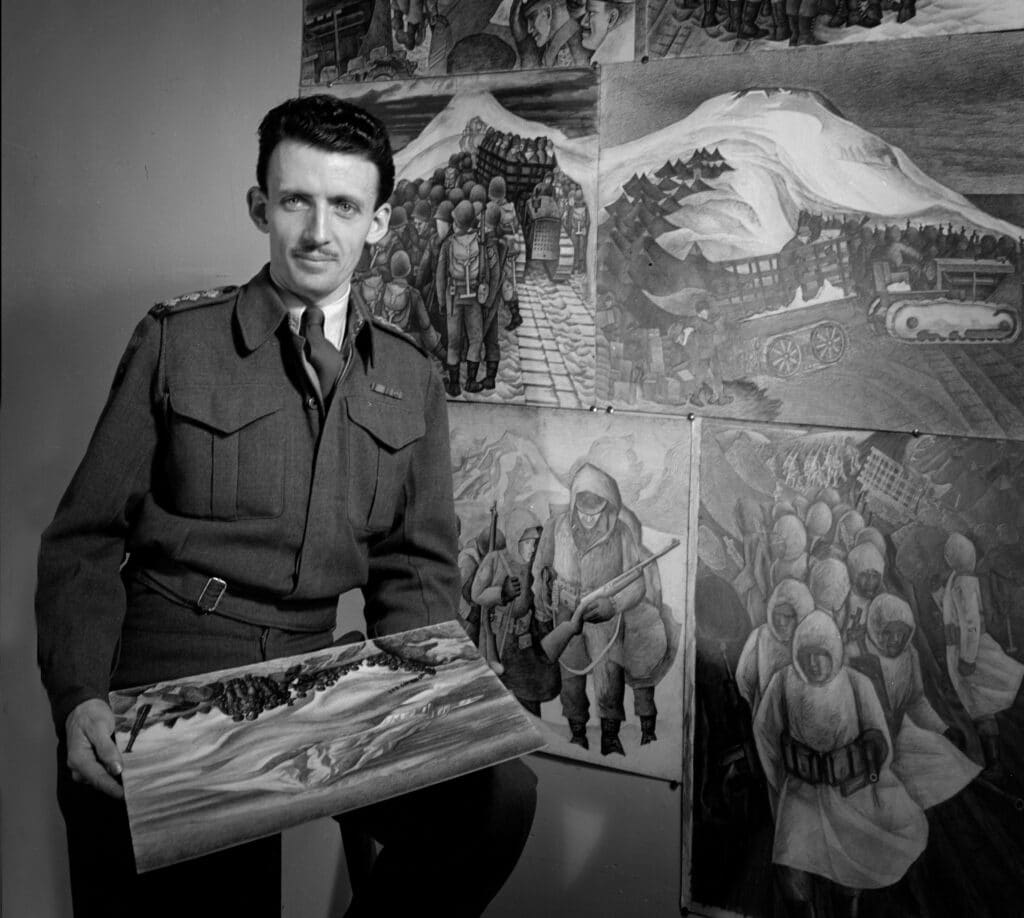 A man in military uniform holds a painting and stands before a wall of wartime drawings.