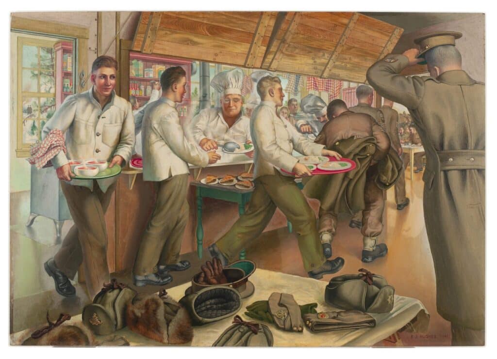 Soldiers carry trays of food in a busy mess hall where a cook serves meals and cold weather gear is piled on a nearby table.