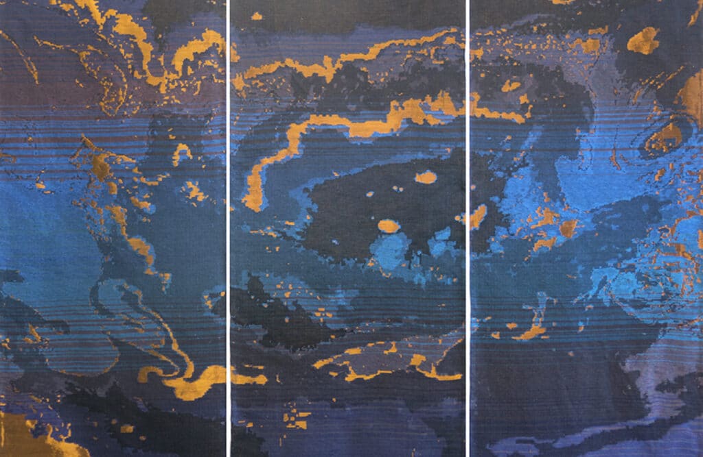 Abstract textile triptych featuring layered blue, black and gold patterns that resemble shifting topographies and fluid, map-like forms, created as a woven artwork.