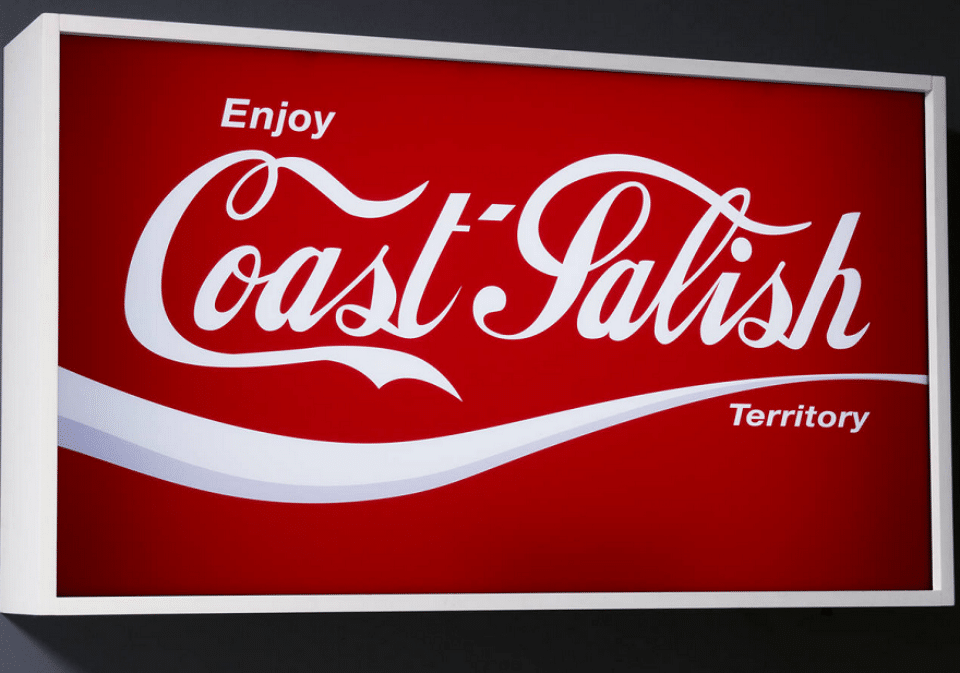 Coke Salish, 2006 Duratrans and light box. With the announcement of Vancouver’s 2010 Winter Olympic Games, Sonny envisioned the event overshadowing the region’s Indigenous history. Vancouver is built on Coast Salish territory and with Coke Salish, Sonny signalled that when visitors arrived in Vancouver, they would “Enjoy Coast-Salish Territory.” Image courtesy Sonny Assu.