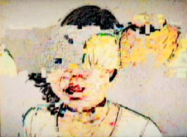 A digitally distorted portrait of a person with fragmented colours and blurred facial features