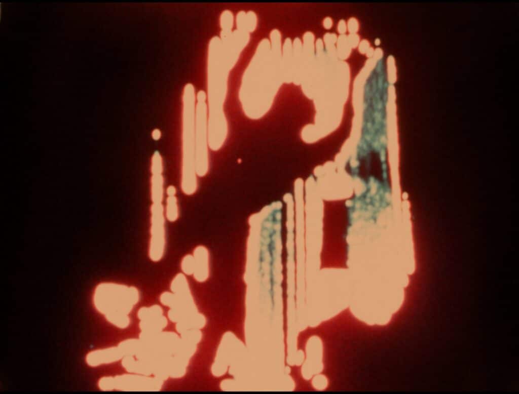 An abstract image featuring glowing, organic shapes in red and orange tones against a dark background