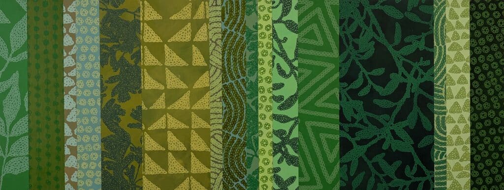 Close-up of painted vertical bands in shades of green, where repeating botanical and geometric patterns create a layered rhythm inspired by leaves, vines and woven forms.