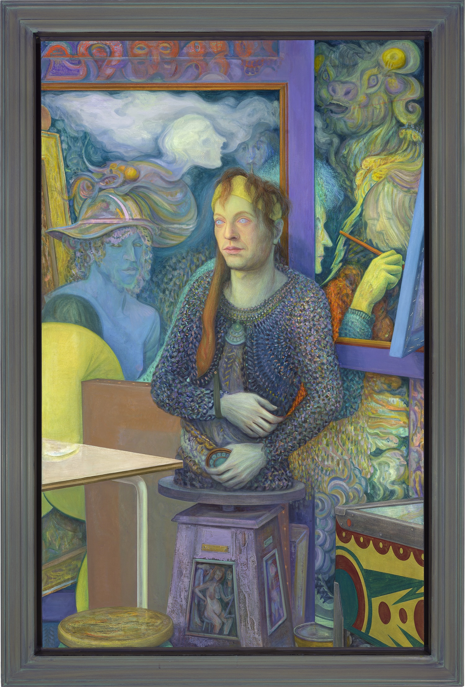 A surreal painting of a long-haired figure in a textured blue sweater, seated among layered paintings and sculptural imagery in shades of blue, green and purple.